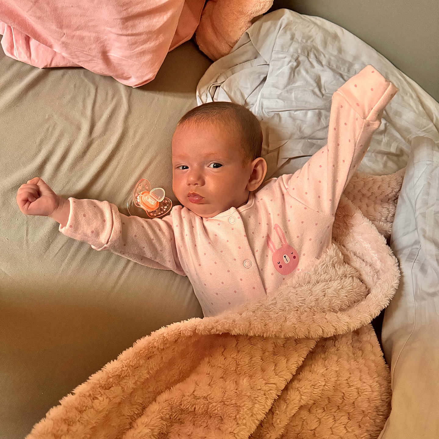 Miia is registered to the contest to win money with this photo: baby, bed, blanket, child, comfort, cozy, cute, face, indoors, infant, newborn, pacifier, pajamas, person, pillow, pink, resting, sleepy, soft, stretching