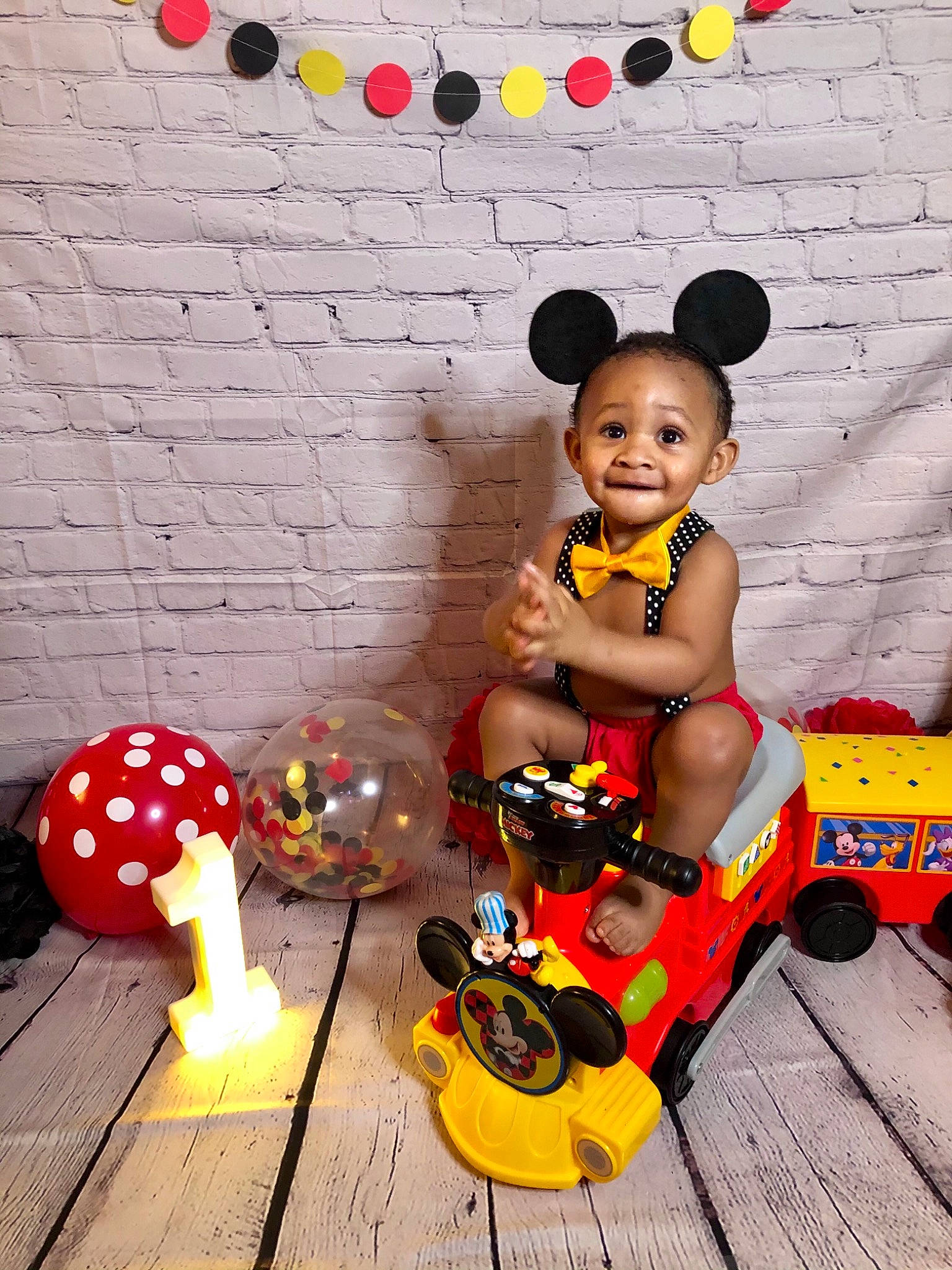 Kyree joined the competition — help win amazing prizes! baby, baby_products, baby_toddler_clothing, child, doll, event, fashion_accessory, fun, happy, hat, orange, person, play, sandal, sitting, smile, toddler, toy, toy_vehicle, wheel