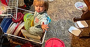 Avery joined the competition — help win amazing prizes! child, toddler, basket, plastic_lids, floor, kitchen, container, messy, curious, standing, sitting, clothing, toy, household, indoor, playful, reaching, flooring, broom, storage