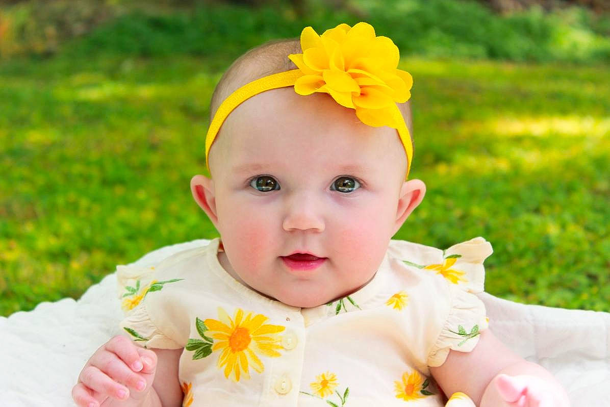 Cheyenne joined the competition — help win amazing prizes! baby, baby_toddler_clothing, cheek, dress, eye, face, flower, grass, green, happy, head, headband, headgear, headwear, iris, people_in_nature, person, photograph, plant, skin