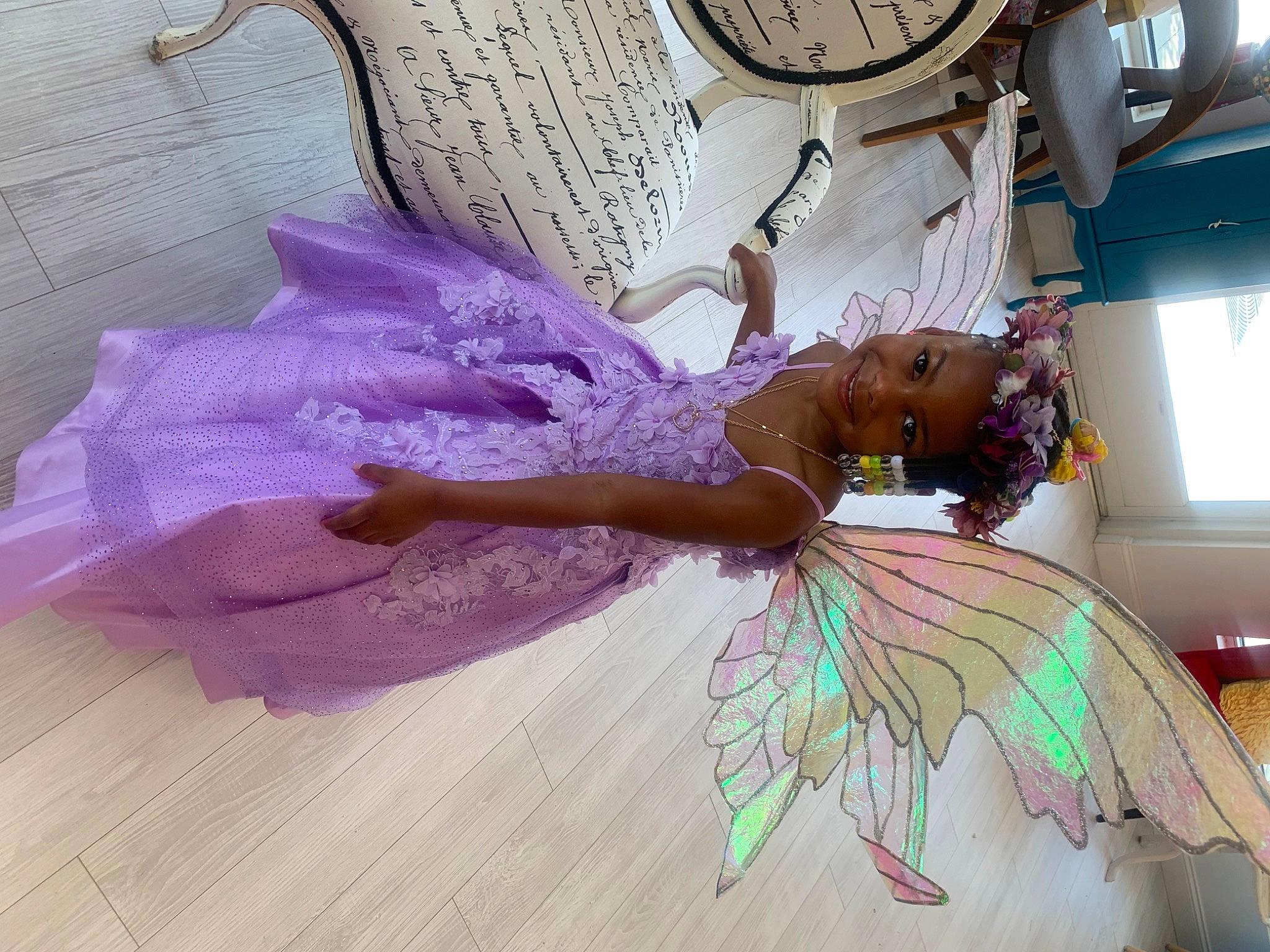 Amillian is registered to the contest to win money with this photo: art, bridal_accessory, bride, child, costume, costume_design, dress, event, fashion_accessory, fashion_design, feather, gown, happy, headpiece, joy, magenta, person, pink, purple, room
