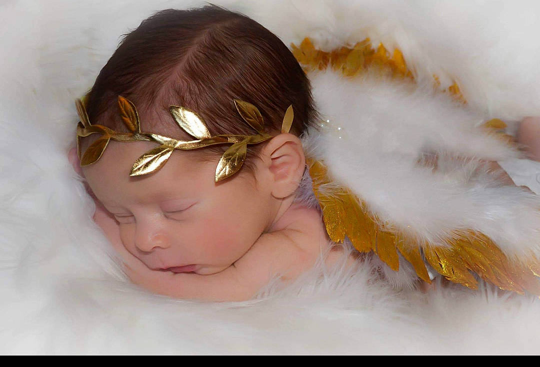 Nicoli joined the competition — help win amazing prizes! angel, baby, brown_hair, cheek, child, ear, eye, face, fashion_accessory, feather, forehead, hair, hair_accessory, head, headband, headgear, headpiece, person, skin, toddler