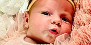 Sofia joined the competition — help win amazing prizes! adorable, baby, bow, child, close_up, curious, cute, face, fluffy, headband, infant, lying_down, newborn, peach_clothing, pink_blanket, portrait, ruffles, skin, soft_toy, stuffed_animal