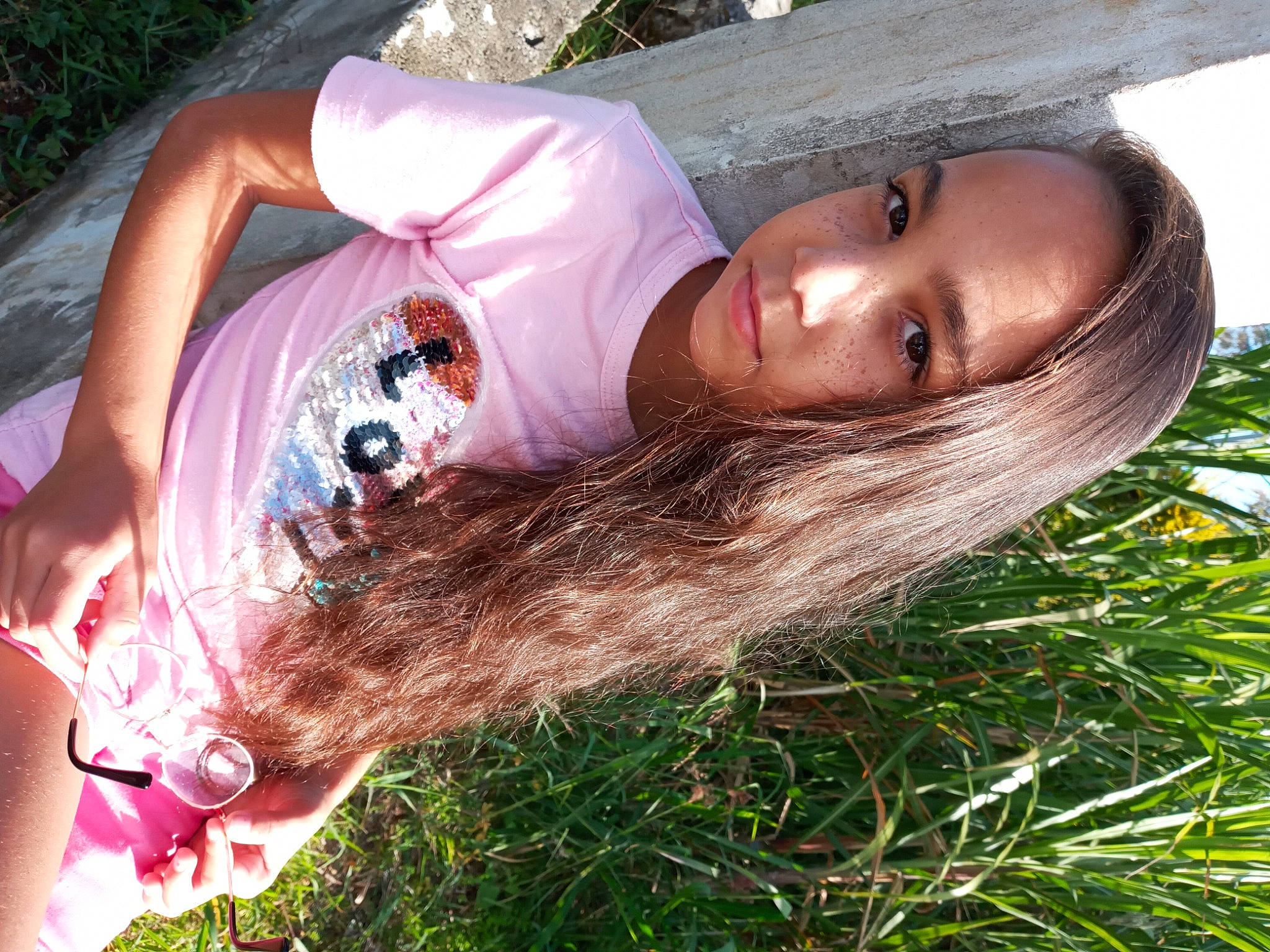 Maëlya participe au concours pour gagner de l'argent avec cette photo : black_hair, brown_hair, cool, dress, eyewear, fawn, fun, grass, grass_family, happy, human_body, human_leg, leisure, long_hair, mammal, people_in_nature, person, plant, skin, thigh