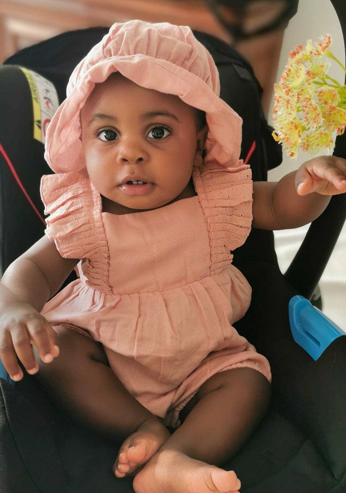 Lunayah participe au concours pour gagner de l'argent avec cette photo : baby, baby_products, baby_toddler_clothing, cap, cheek, child, comfort, fashion_accessory, finger, fun, gesture, happy, headwear, human_leg, lip, person, pink, sitting, skin, thigh