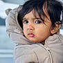 child, toddler, face, portrait, jacket, clothing, winter_wear, hair, eyes, expression, outdoor, cold_weather, cute, person, young_child, closeup, warm_clothing, curious, soft_light, head