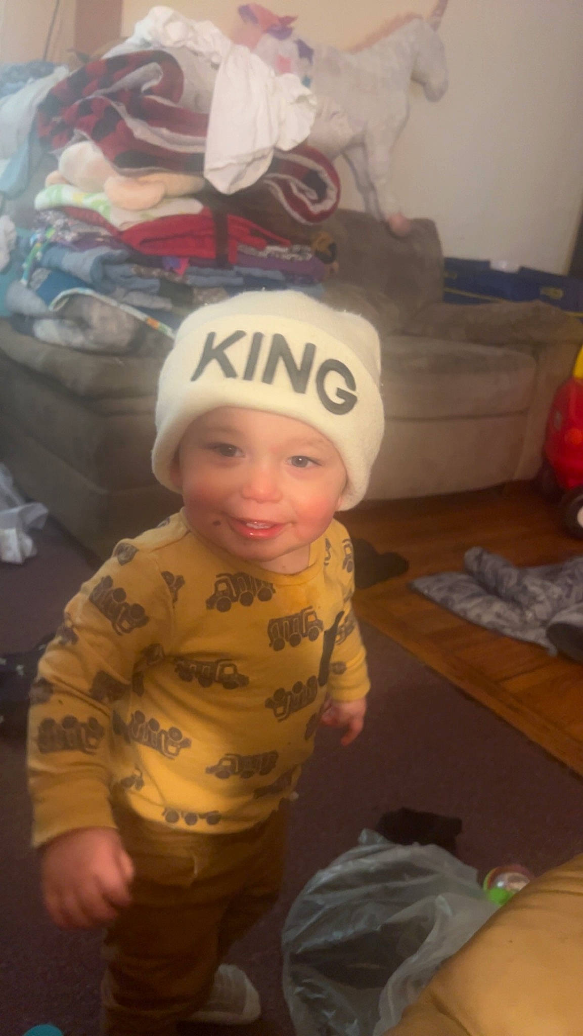 Jamison is registered to the contest to win money with this photo: baby, baby_laughing, baby_toddler_clothing, baseball_cap, cap, cheek, child, costume_hat, flooring, fun, happy, headgear, headwear, helmet, joy, person, personal_protective_equipment, room, sleeve, smile