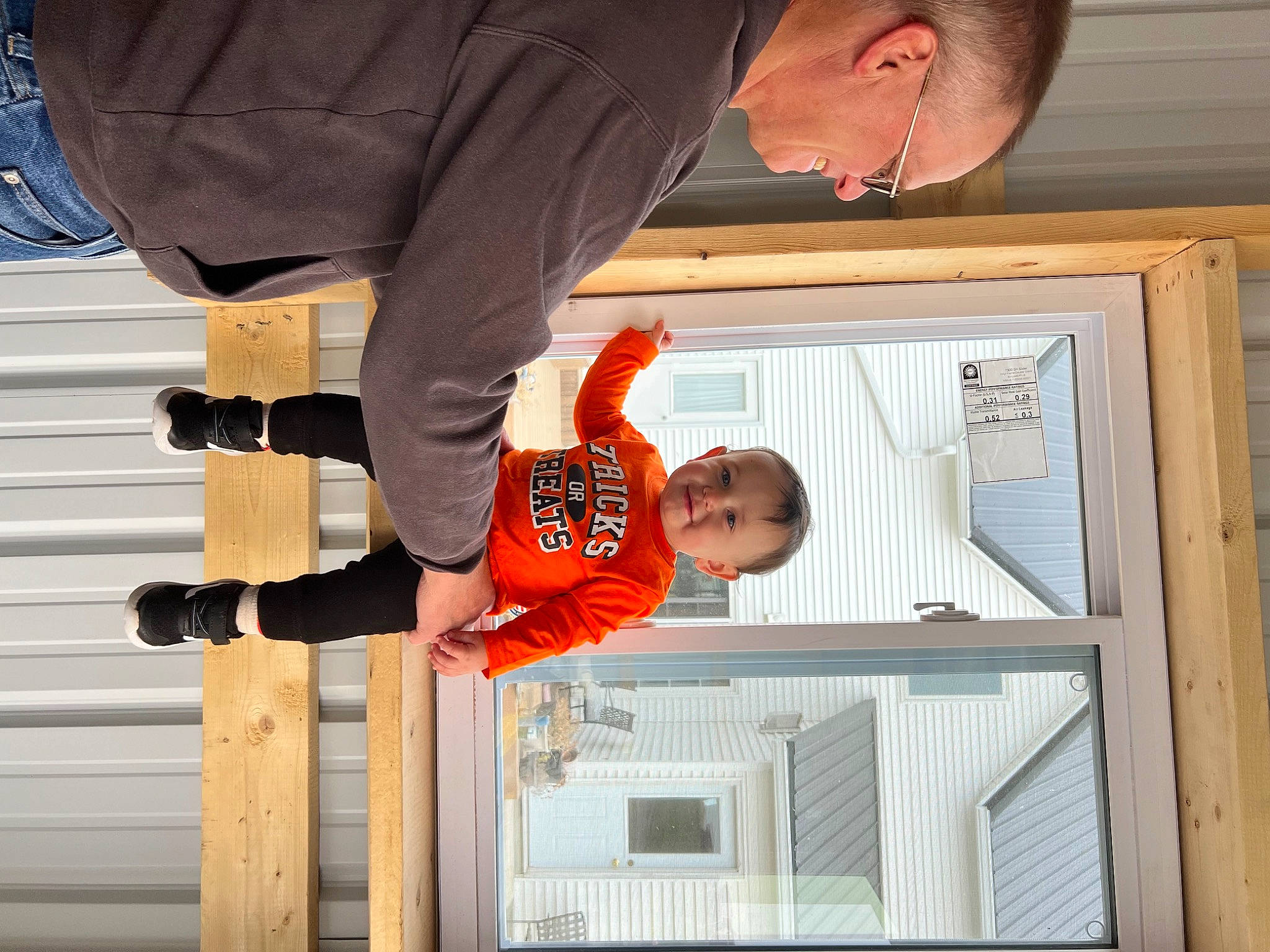 Jamison joined the competition — help win amazing prizes! child, door, fun, gesture, happy, house, jeans, joy, leisure, person, room, siding, smile, standing, toddler, tree, window, wood