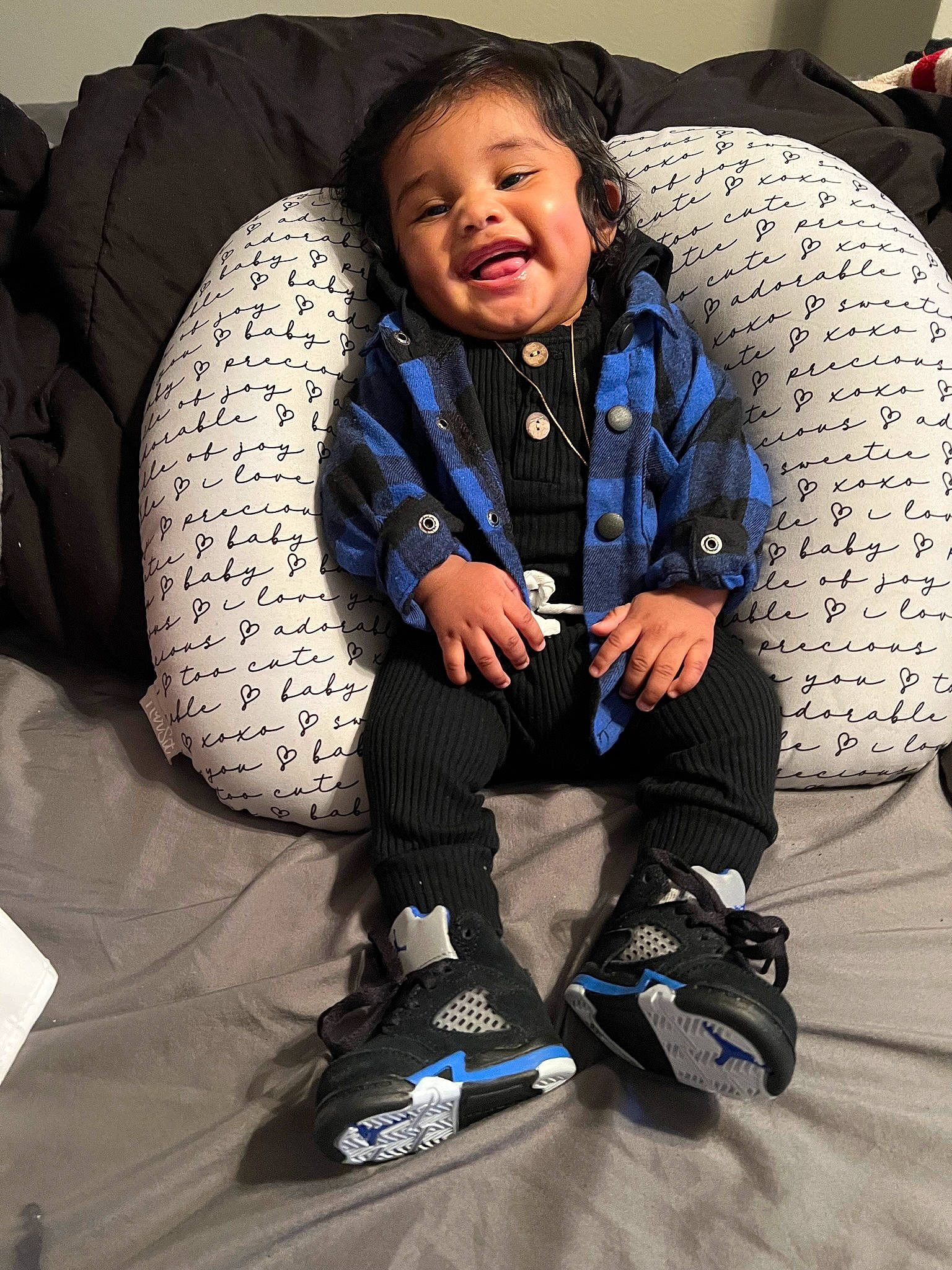 Jacieon is registered to the contest to win money with this photo: baby_products, baby_toddler_clothing, child, comfort, cool, couch, electric_blue, flooring, fun, fur, happy, joy, linens, pattern, person, personal_protective_equipment, play, sitting, sleeve, smile