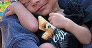 Lataivean is registered to the contest to win money with this photo: arms, baby, black_shirt, child, close_up, clothing, cute, happy, hat, holding, infant, newborn, outdoor, person, portrait, skin_texture, sleepy, smiling, teddy_bear, tender_moment