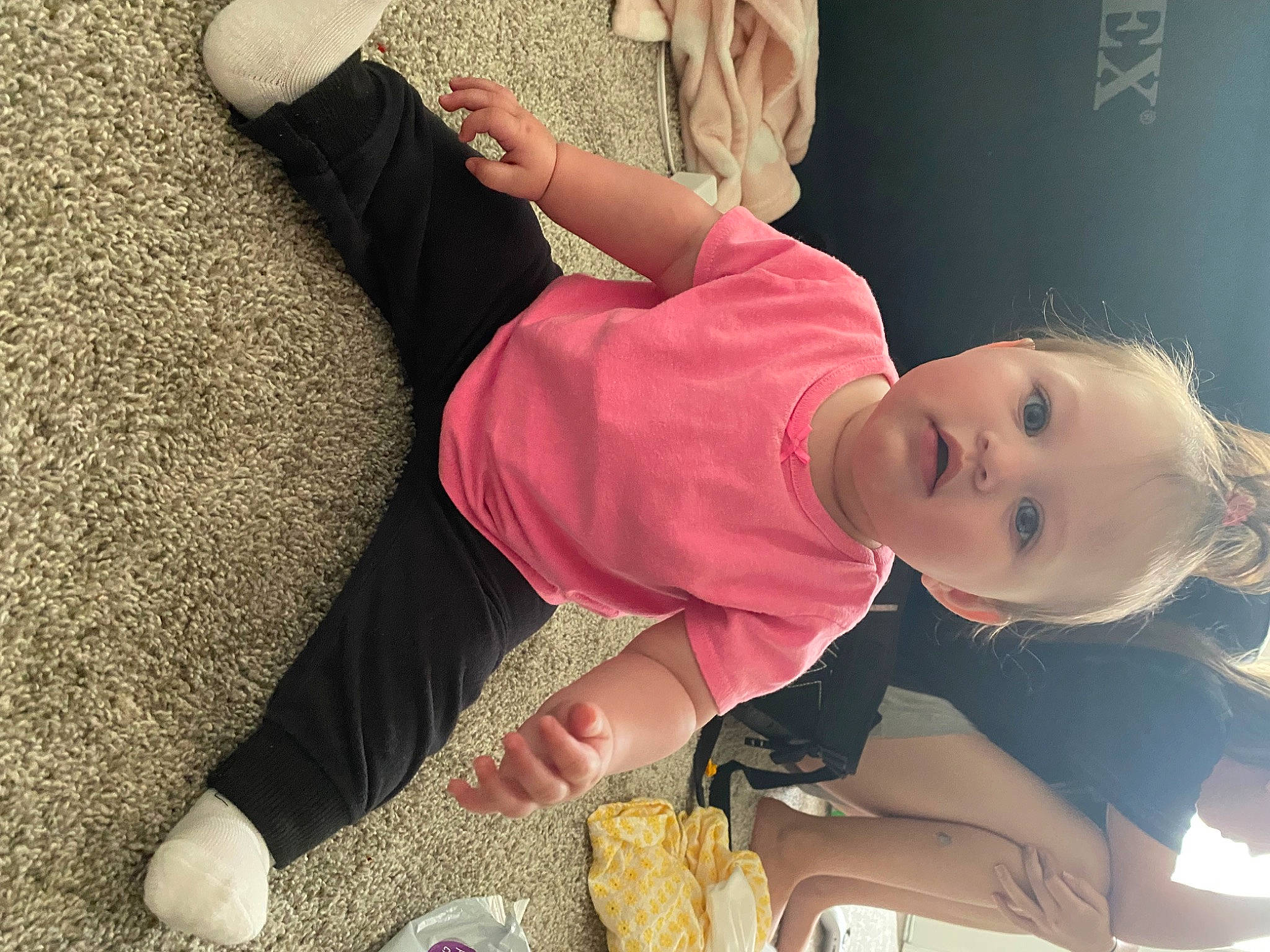 Adalina is registered to the contest to win money with this photo: child, comfort, elbow, flooring, foot, fun, happy, hat, human_body, human_leg, joint, knee, leisure, linens, person, room, sitting, sunglasses, thigh, toddler