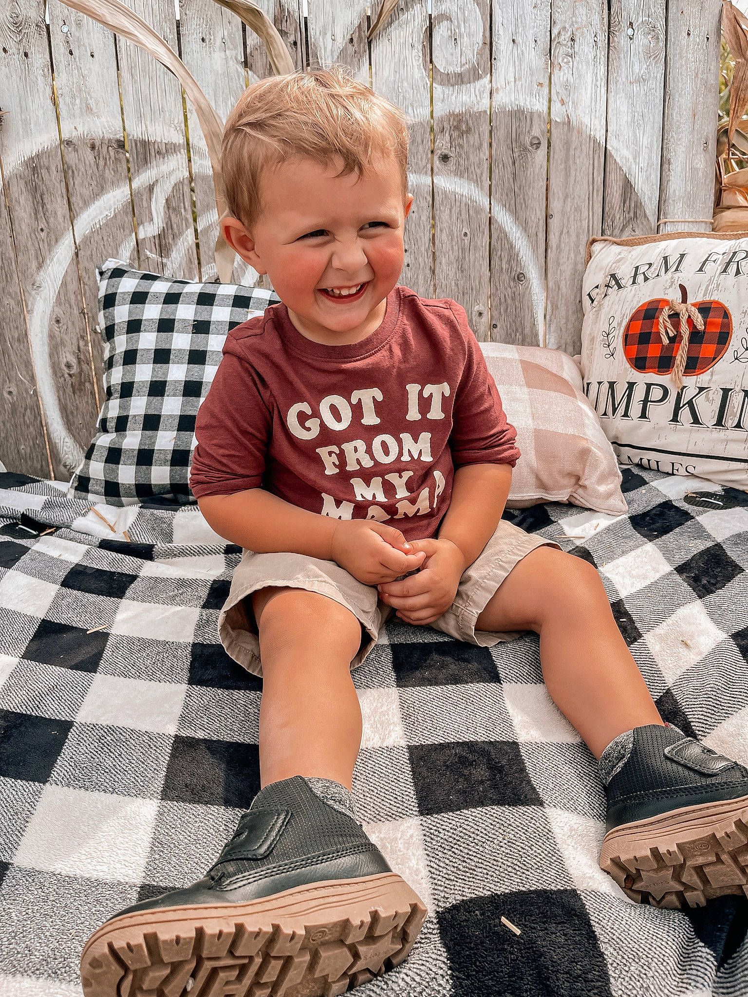 Landyn joined the competition — help win amazing prizes! child, comfort, cool, fashion, flooring, grass, hairstyle, happy, human_leg, joy, knee, pattern, person, plaid, sitting, sleeve, smile, sock, style, t_shirt