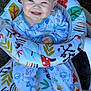 Stetson is registered to the contest to win money with this photo: baby, smiling, child, pajamas, animal_print, baby_seat, colorful, happy, cute, infant, face, sitting, footed_pajamas, patterned, indoors, clothing, comfort, joy, portrait, young