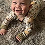 Stetson joined the competition — help win amazing prizes! baby, smiling, onesie, infant, happy, lying_down, carpet, soft_texture, cute, child, young, indoors, crawling, face, hands, feet, expression, cozy, warm, playful