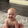 baby, smiling, infant, sitting, cute, happy, child, indoor, soft_rug, naked_torso, diaper, floor, portrait, young, crawling, skin, head, hands, legs, expression