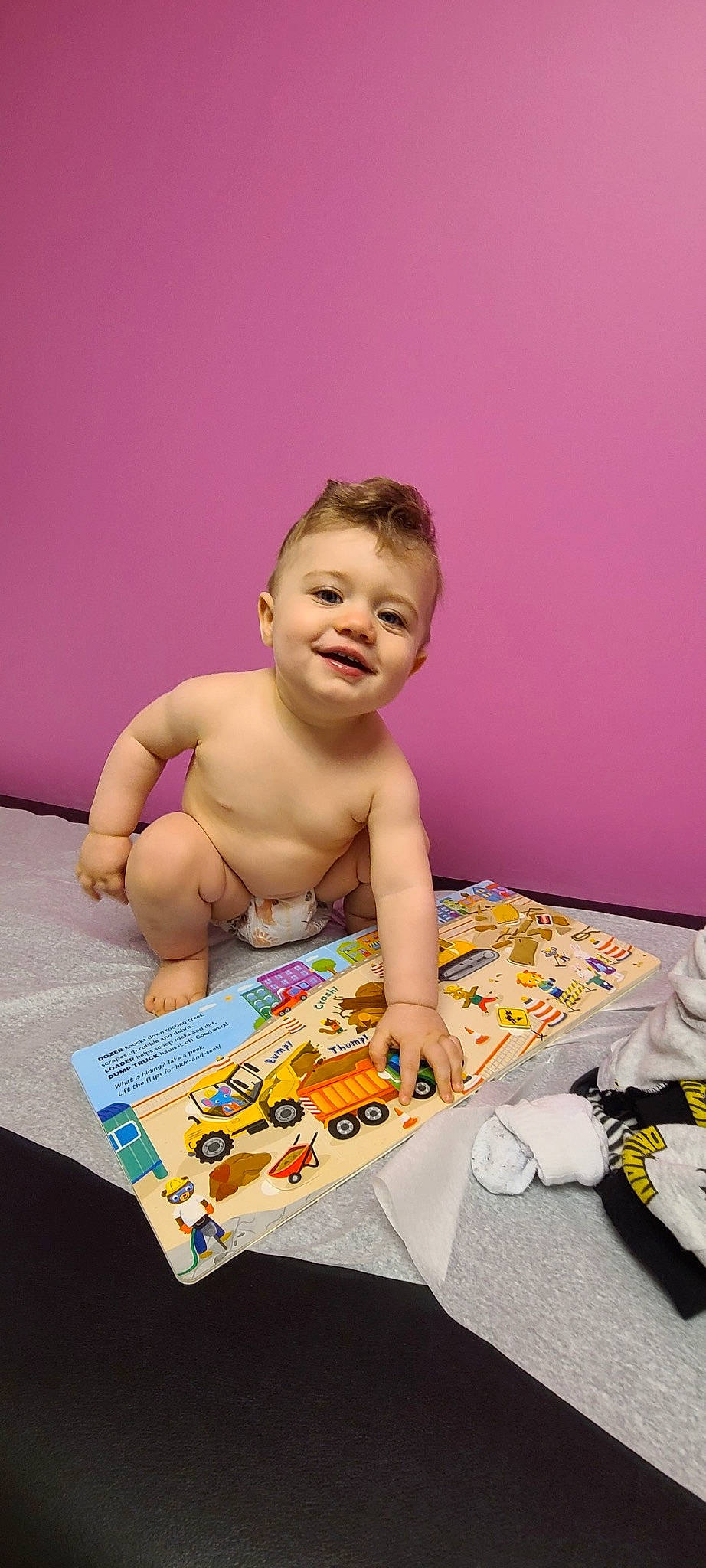 Teddy is registered to the contest to win money with this photo: baby, barechested, bathing, chest, child, flooring, fun, happy, joy, leisure, person, play, recreation, room, sitting, smile, toddler