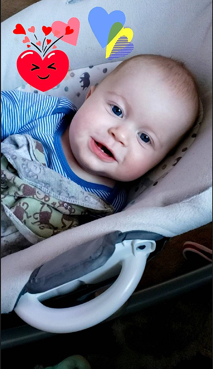 Dillinger is registered to the contest to win money with this photo: baby, baby_products, baby_toddler_clothing, beauty, cheek, child, face, flash_photography, happy, linens, pattern, person, portrait_photography, product, sitting, sleeve, smile, t_shirt, tableware, textile