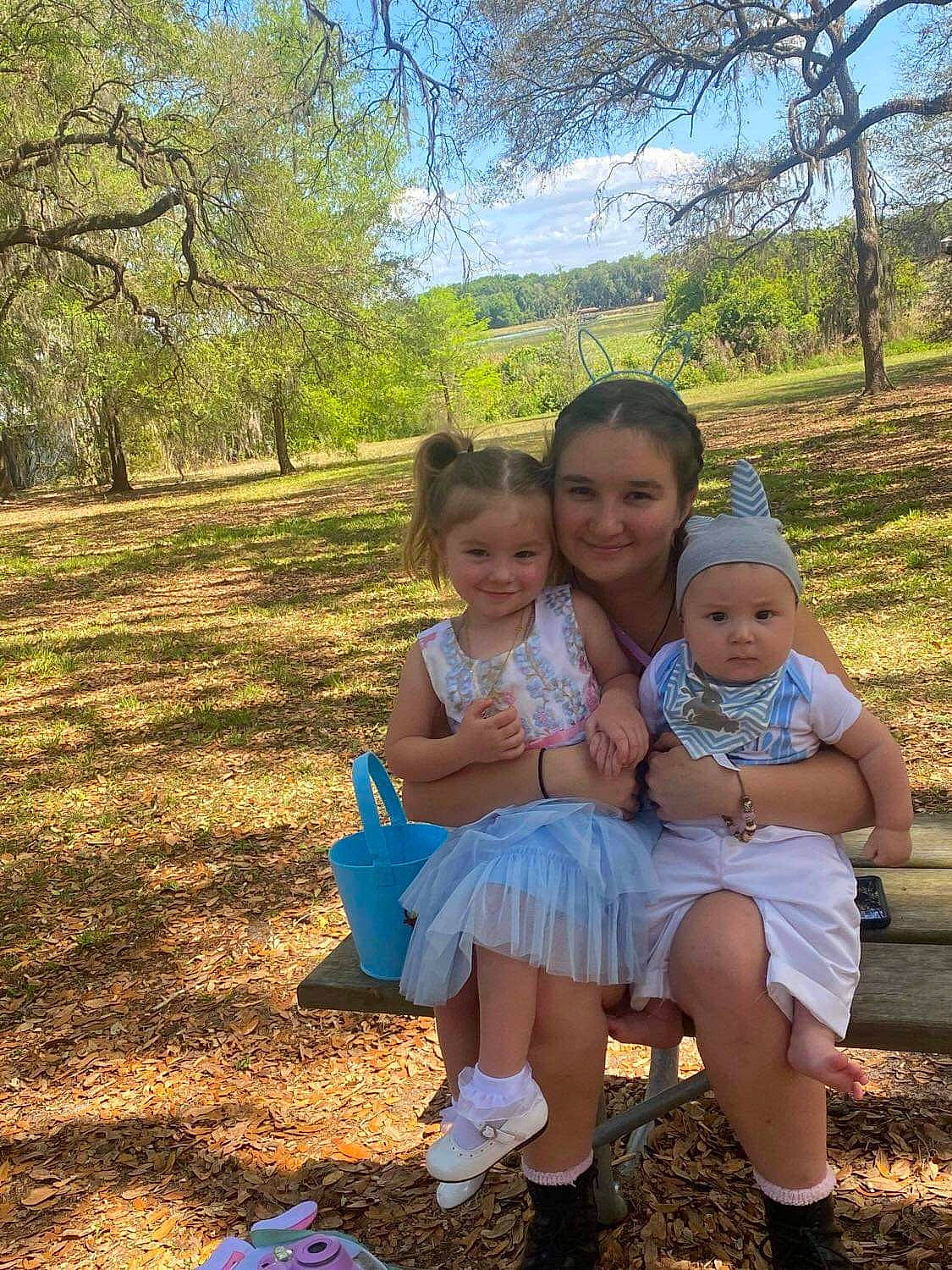 Lilith is registered to the contest to win money with this photo: baby, child, dress, event, face, fun, grass, grassland, happy, headwear, iris, joy, landscape, leg, leisure, people_in_nature, person, plant, recreation, sky