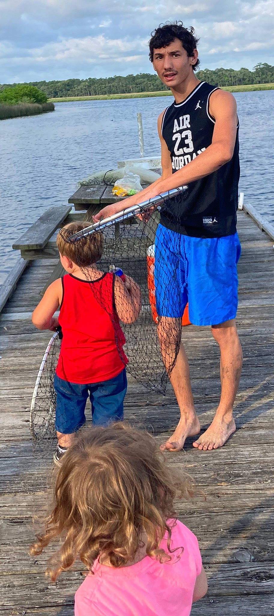 Bailey Damron is registered to the contest to win money with this photo: barefoot, blue, board_short, boat, boats_and_boating_equipment_and_supplies, fisherman, fishing, fishing_net, fun, human, lake, leisure, muscle, person, recreation, recreational_fishing, shorts, summer, t_shirt, trunks