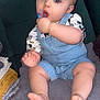 baby, child, pacifier, denim_overalls, sitting, blanket, feet, toes, blue_eyes, indoor, soft_texture, cute, infant, clothing, hand, face, skin, comfort, relaxing, furniture