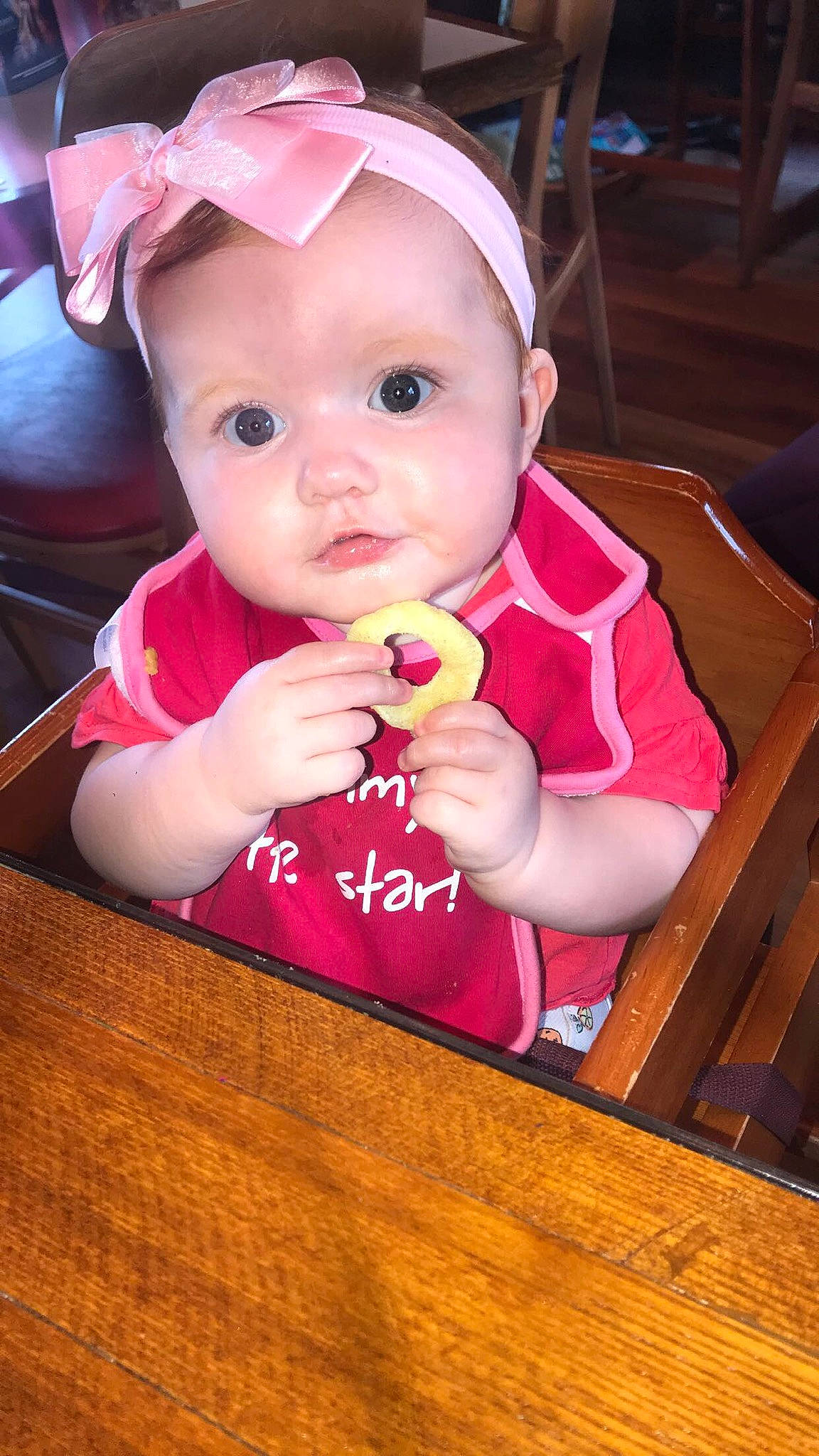 Charlotte is registered to the contest to win money with this photo: baby, cheek, child, eating, eye, face, head, lip, mouth, person, pink, skin, smile, toddler