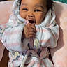 Malaysia joined the competition — help win amazing prizes! baby, child, smiling, happy, robe, fluffy, pink, cushion, heart_pattern, indoor, person, portrait, cute, cozy, infant, clothing, soft, warm, joyful, hands
