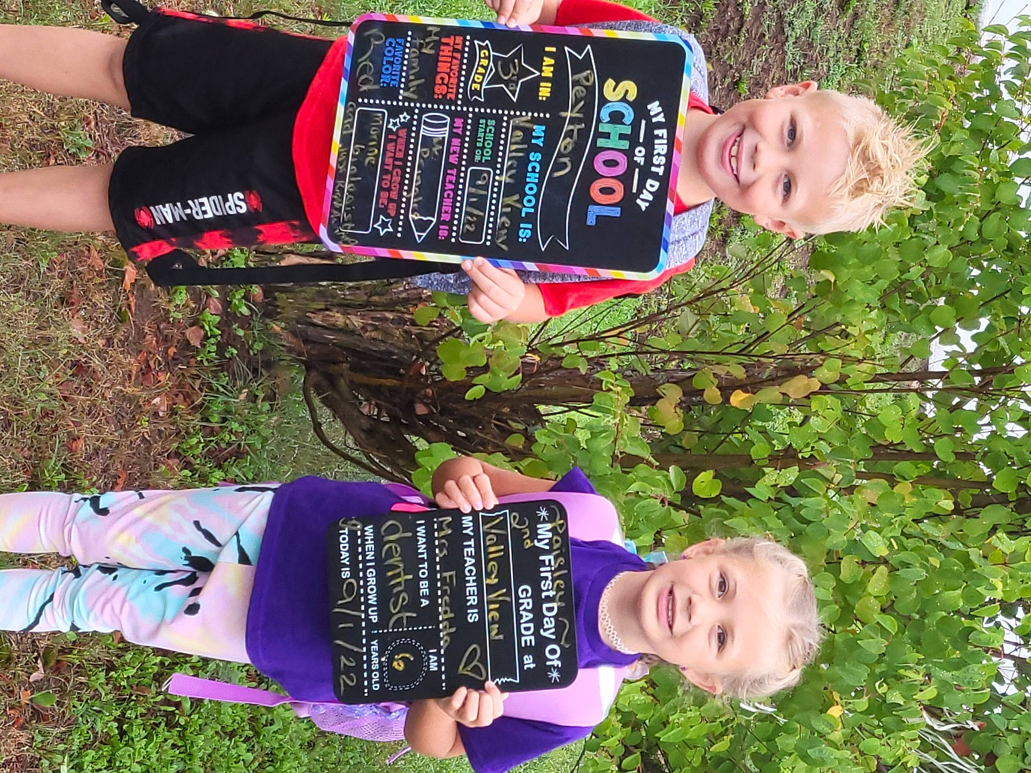 Paisley is registered to the contest to win money with this photo: bottle, child, clothing, electric_blue, fun, grass, green, happy, human_leg, joy, people_in_nature, person, plant, smile, sock, summer, thigh, toddler, tree, wrist