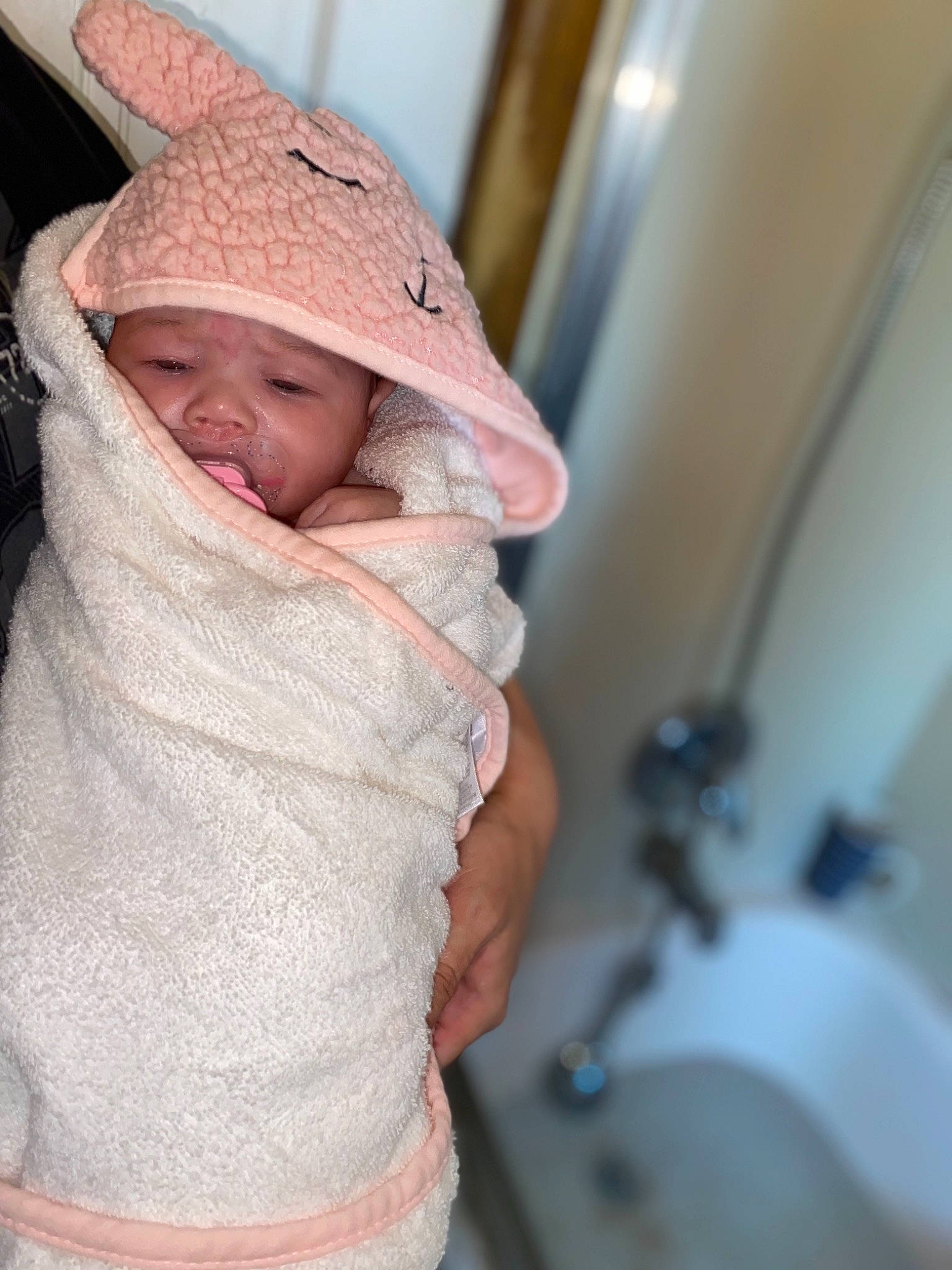 Auria is registered to the contest to win money with this photo: baby, bonnet, child, headgear, headwear, linens, person, skin, toddler