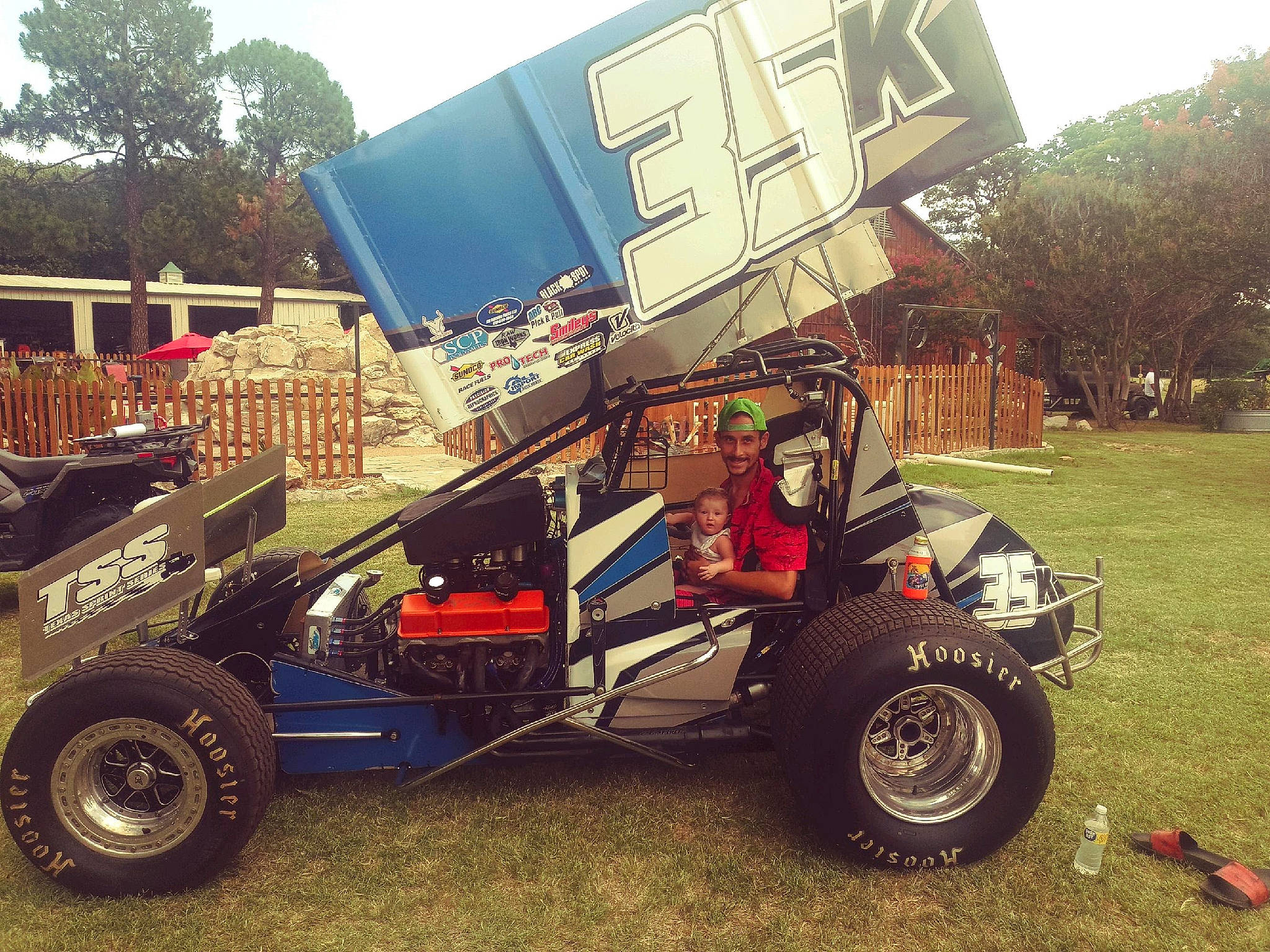 Esylana is registered to the contest to win money with this photo: alloy_wheel, automotive_design, automotive_exterior, automotive_tire, bumper, car, fender, headwear, hood, joy, locking_hubs, motor_vehicle, person, plant, rim, rolling, synthetic_rubber, tire, tread, tree