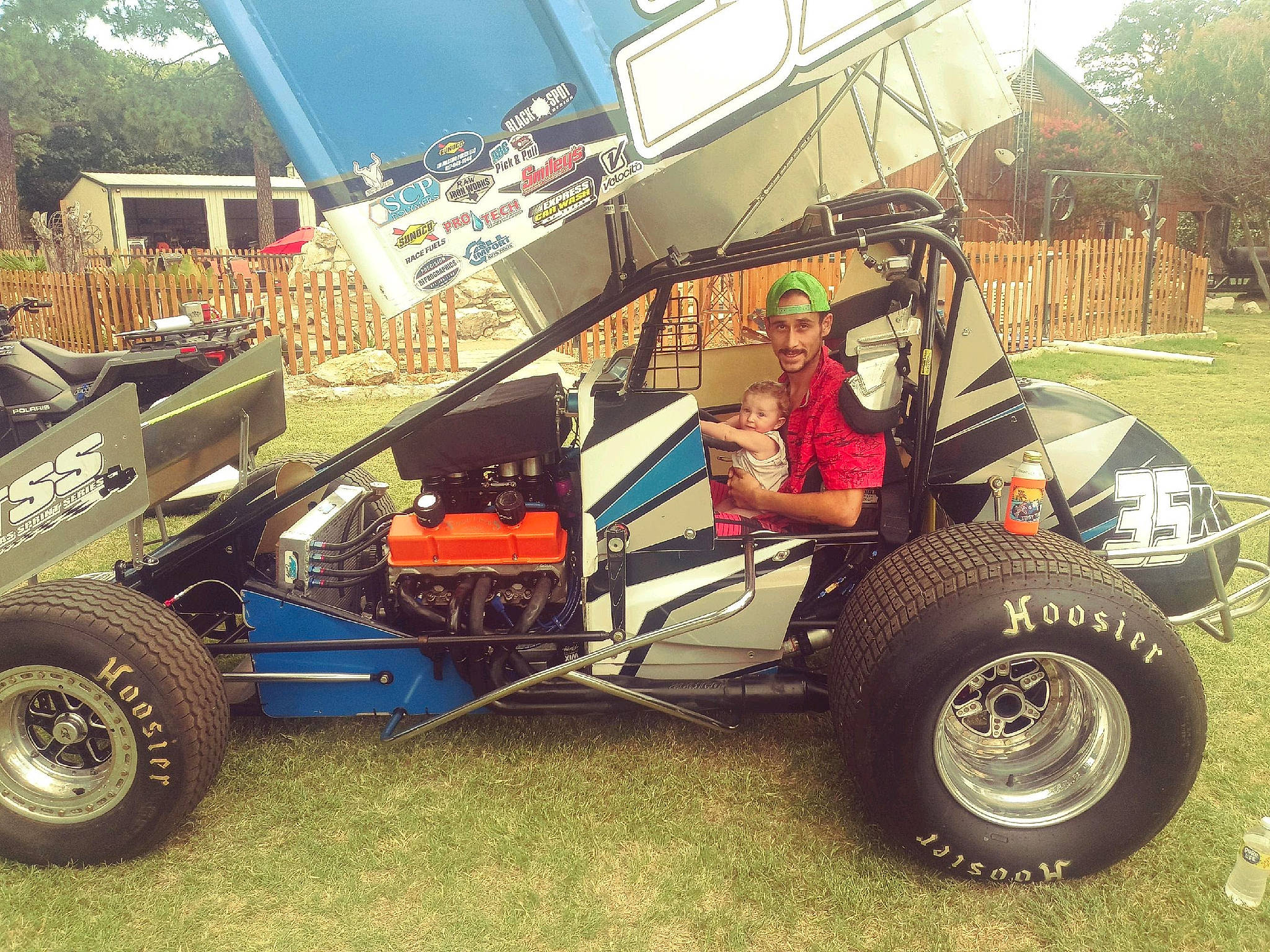 Esylana is registered to the contest to win money with this photo: automotive_design, automotive_exterior, automotive_tire, automotive_wheel_system, bumper, car, fender, headwear, hood, joy, locking_hubs, motor_vehicle, motorsport, person, plant, rim, synthetic_rubber, tire, tread, tree