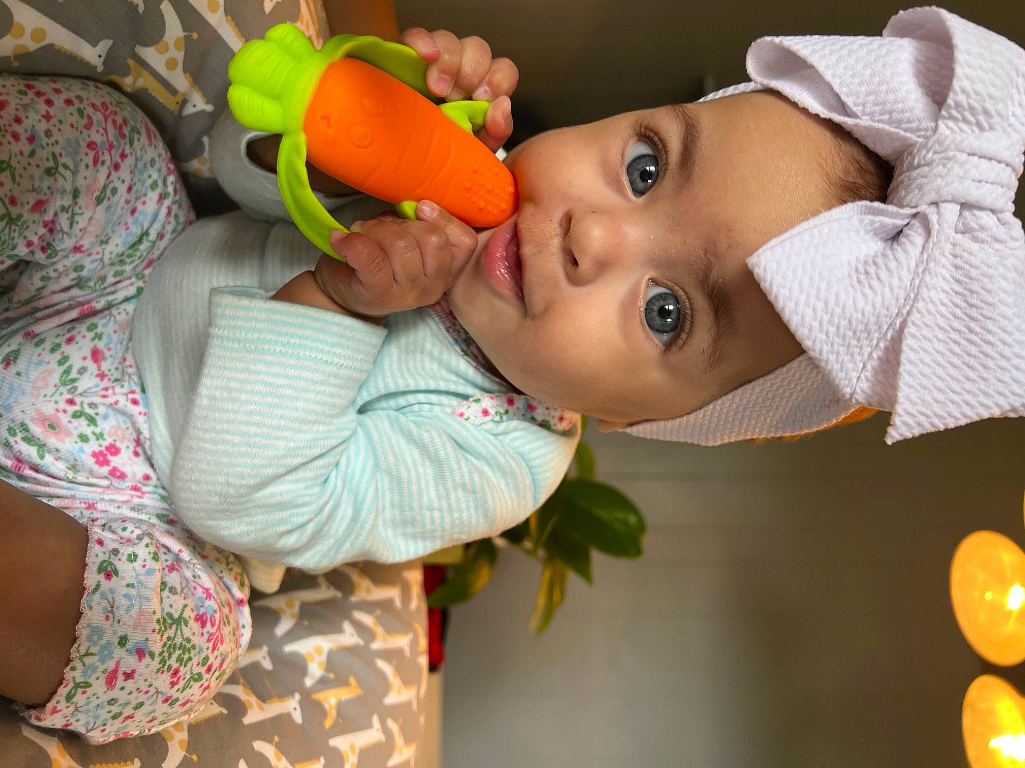 Amayah is registered to the contest to win money with this photo: baby, baby_products, baby_toddler_clothing, child, face, fun, happy, hat, headgear, headwear, iris, lip, nose, orange, person, plant, skin, sun_hat, toddler, toy