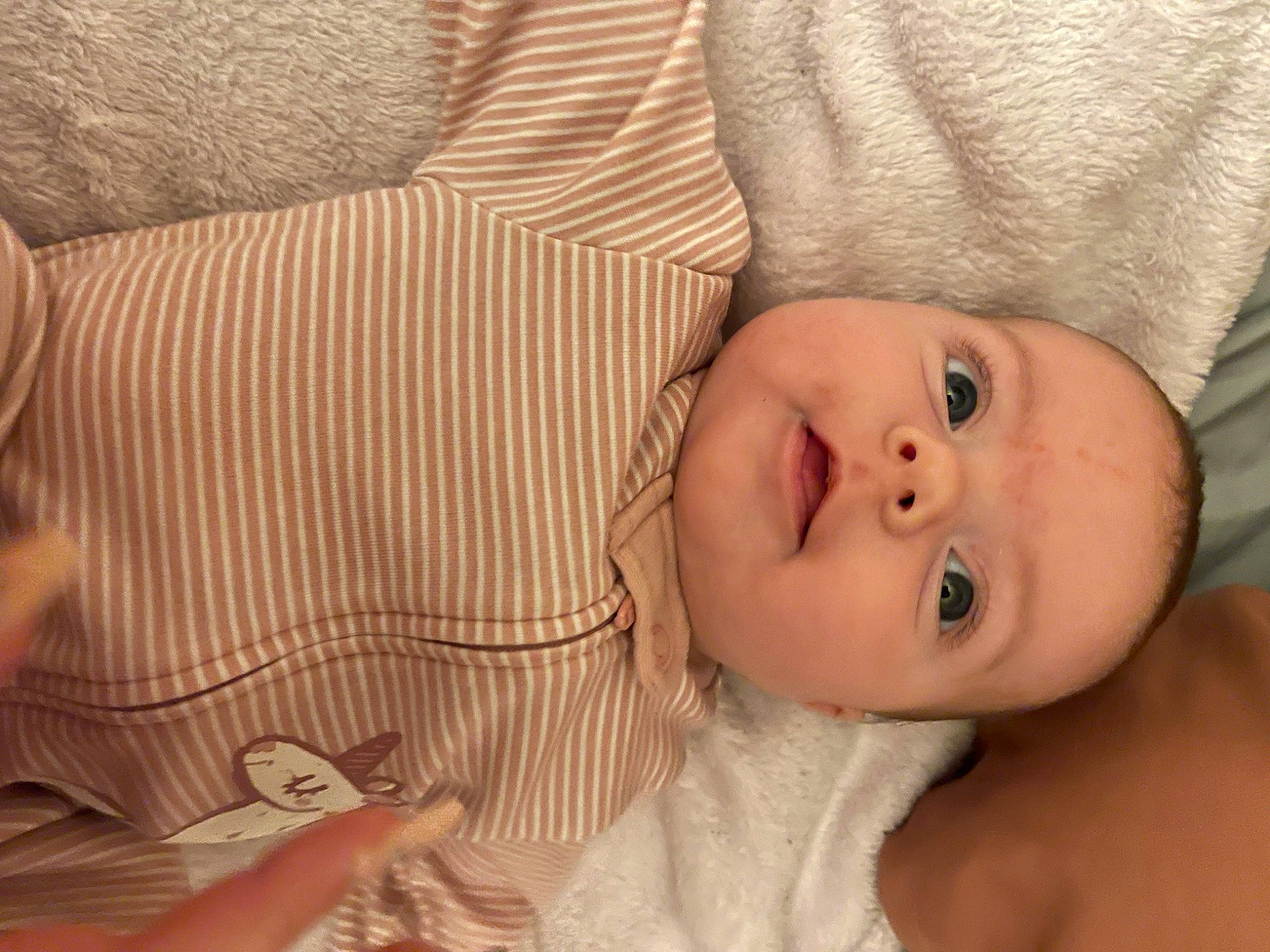 Lorelei is registered to the contest to win money with this photo: baby, baby_toddler_clothing, cheek, chin, comfort, eye, eyebrow, eyelash, finger, happy, human_body, iris, lip, mouth, nose, person, skin, sleeve, smile, toddler