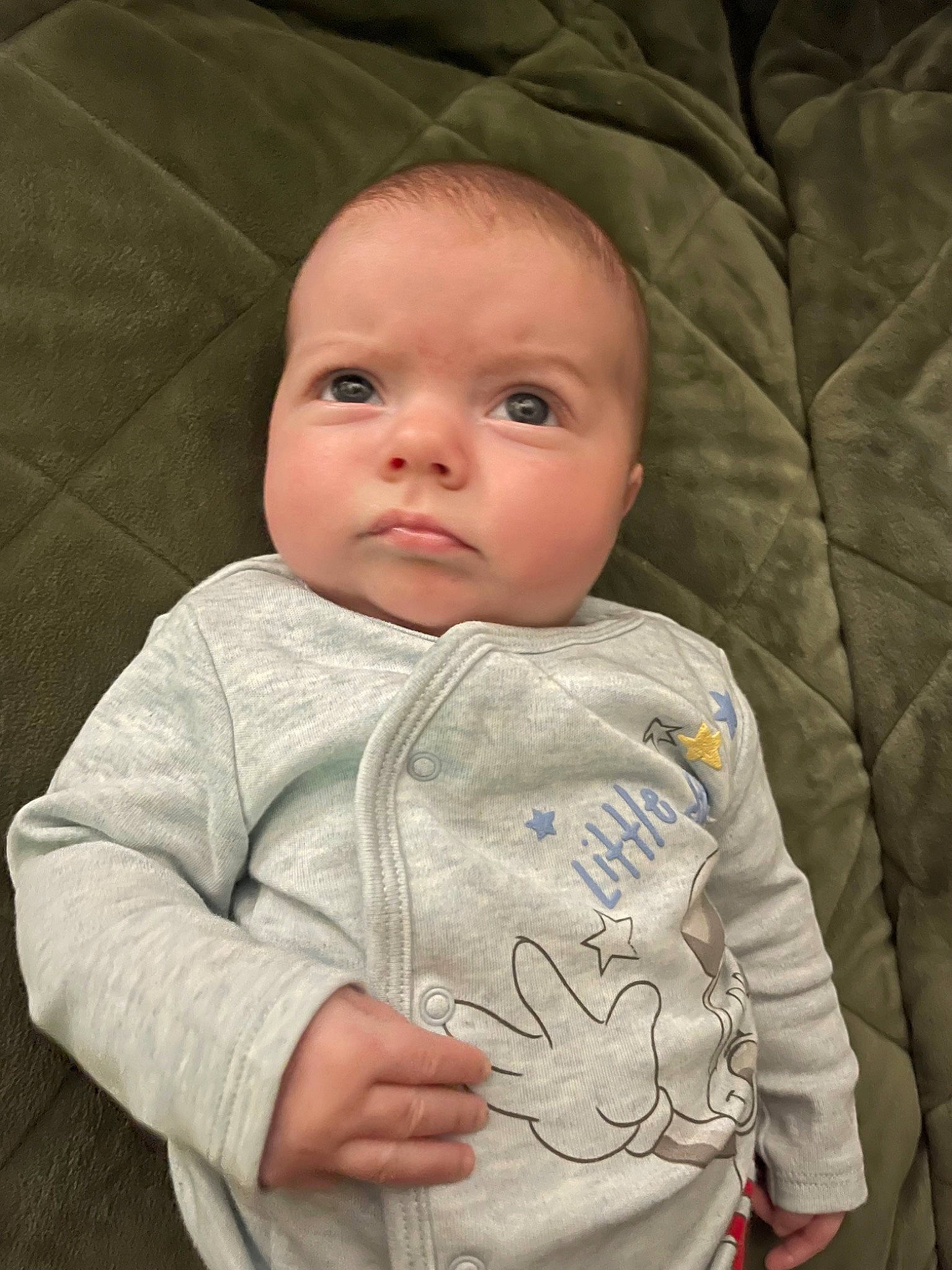 Lorelei is registered to the contest to win money with this photo: baby, baby_products, baby_toddler_clothing, cheek, child, collar, comfort, eye, iris, linens, lip, nose, person, portrait_photography, sitting, skin, sleeve, smile, t_shirt, textile