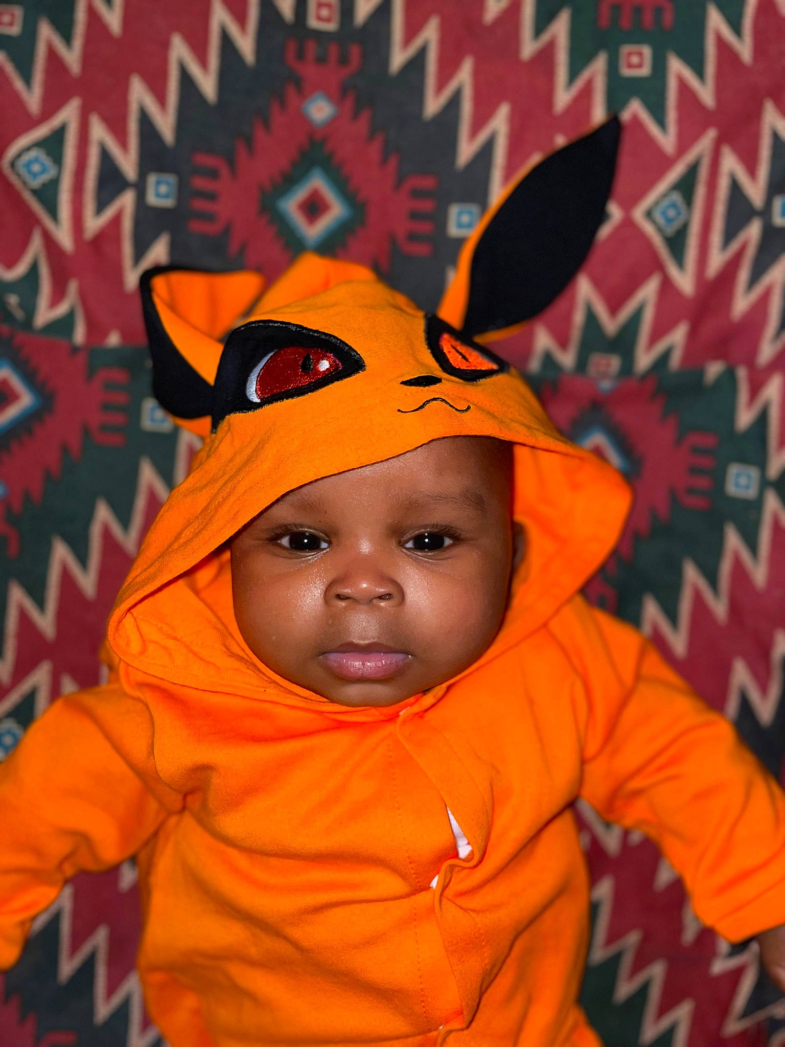 Amya joined the competition — help win amazing prizes! baby, baby_toddler_clothing, cap, child, clothing, costume, costume_hat, facial_expression, fun, happy, headgear, headwear, hood, hoodie, jacket, orange, outerwear, person, personal_protective_equipment, sleeve