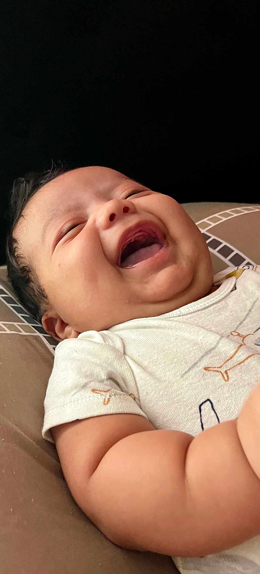 Roilan joined the competition — help win amazing prizes! baby, laughing, close_up, infant, chubby_cheeks, smile, cushion, pattern, white_clothing, happy, face, skin, arm, lying_down, indoor, child, cute, joy, expression, portrait