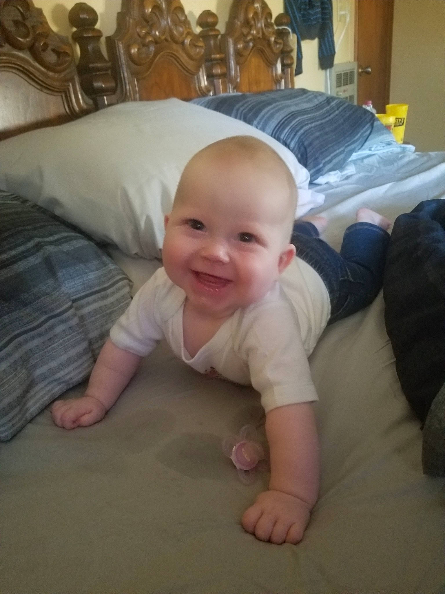 Chevy Cheyenne Marie is registered to the contest to win money with this photo: arm, baby, beauty, cheek, child, crawling, eye, face, fun, head, joy, leg, mobile_phone, mouth, person, product, skin, sky, smile, toddler