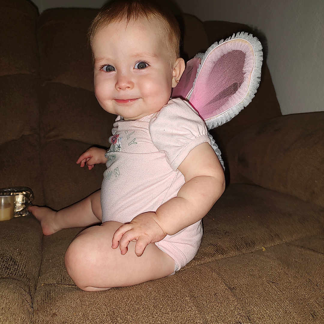 Priscilla joined the competition — help win amazing prizes! architecture, baby, bodypart, chair, clothing, couch, cushion, face, finger, furniture, hand, happy, hat, head, homedecor, person, photography, portrait, sitting, smile