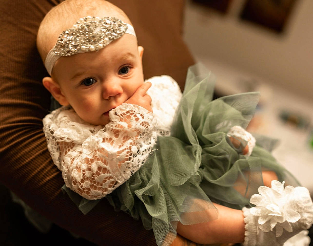 Serafina is registered to the contest to win money with this photo: baby, baby_toddler_clothing, bridal_accessory, cap, child, dress, embellishment, event, finger, flash_photography, flower, happy, headgear, headpiece, headwear, jewellery, person, petal, plant, rose