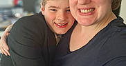 James joined the competition — help win amazing prizes! affection, black_jacket, blond_hair, blue_shirt, casual_clothing, child, closeup, face, family, happy, hug, indoor, love, person, portrait, short_hair, smile, together, warmth, woman