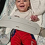 baby, baby_rocker, barefoot, child, clothing, comfort, cushion, cute, expression, face, happy, head, indoor, infant, person, red_pants, seat, skin, smiling, white_shirt