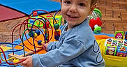 Orlando joined the competition — help win amazing prizes! toddler, child, toy, bead_maze, play_mat, indoor, flooring, smile, clothing, sitting, colorful, playtime, person, happy, wooden_floor, furniture, early_childhood, developmental_toy, casual, interaction