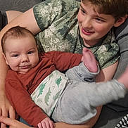 Orlando joined the competition — help win amazing prizes! arm, baby, candid, casual_clothing, child, couch, cozy, family, happy, holding, human, indoor, infant, playful, portrait, relaxing, sibling, smile, toddler, young