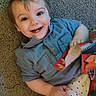 Orlando joined the competition — help win amazing prizes! toddler, child, smiling, blue_shirt, carpet, blanket, patchwork, happy, indoor, cute, baby, face, portrait, sitting, hand, toy, cozy, young_child, infant, playful