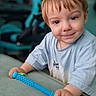 Orlando is registered to the contest to win money with this photo: blue_toy, casual_clothing, child, close_up, couch, eyes, face, furniture, hands, happy, home, indoor, portrait, red_hair, short_hair, sitting, smiling, t_shirt, toddler, toy