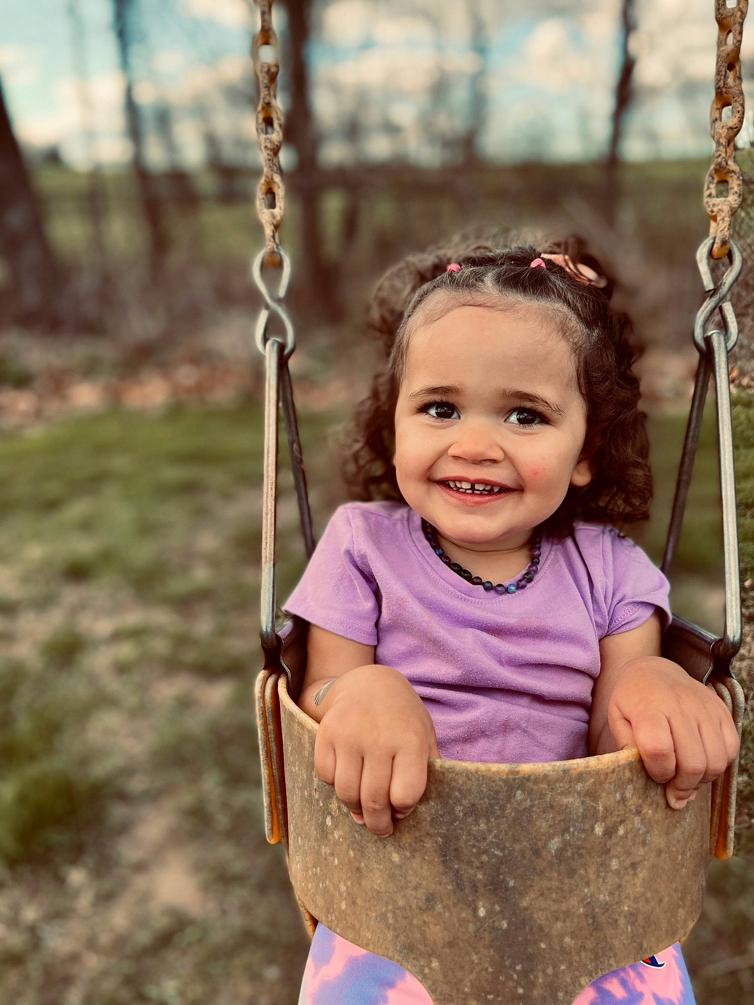 Haisley Mae joined the competition — help win amazing prizes! baby, baby_toddler_clothing, eye, face, facial_expression, grass, hairstyle, happy, head, joy, leaf, leisure, natural_environment, nature, people_in_nature, person, photograph, playground, smile, swing