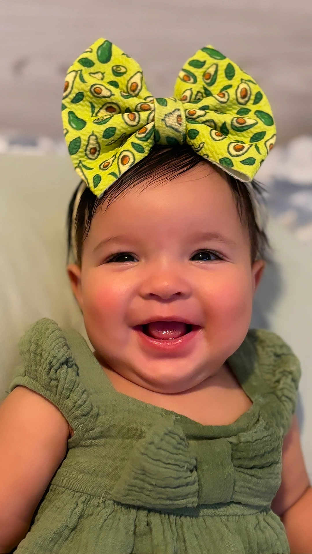 Yareyshka is registered to the contest to win money with this photo: baby, child, smiling, face, bow, headband, green_dress, close_up, cute, happy, infant, portrait, indoors, skin, person, clothing, cheerful, young, fashion, accessory