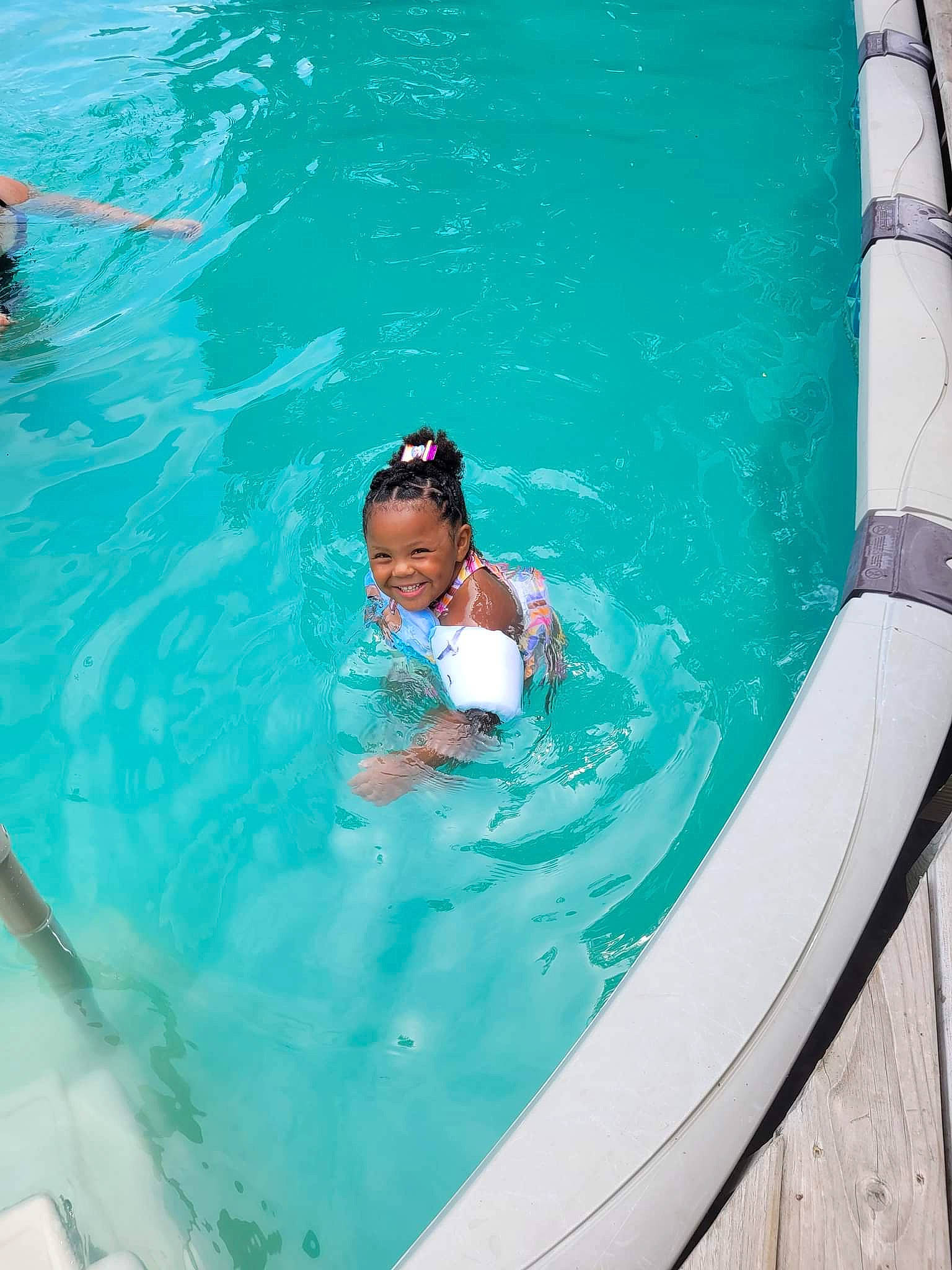 Ariyanna is registered to the contest to win money with this photo: aqua, azure, composite_material, elbow, fun, games, hat, joy, leisure, leisure_centre, nonbuilding_structure, outdoor_recreation, person, personal_protective_equipment, recreation, sports, swimming_pool, swimwear, thigh, vacation