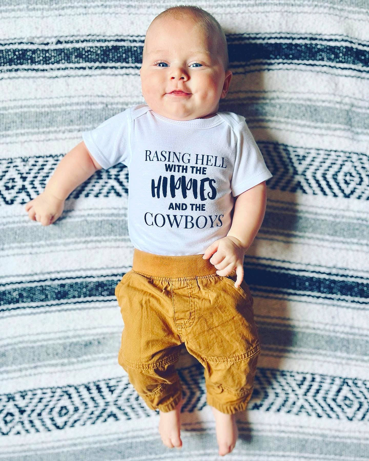 Huxton joined the competition — help win amazing prizes! baby_toddler_clothing, blue, child, cool, floor, flooring, grey, happy, khaki_pants, neck, pattern, people, person, photograph, shoulder, sleeve, t_shirt, toddler, waist, wood