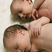 Paisley And Oakley is registered to the contest to win money with this photo: baby, newborn, infant, twin_babies, sleeping, naked, skin, hand, ear, face, portrait, close_up, white_blanket, soft_texture, resting, sibling, cute, peaceful, sleep, nursery