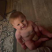 Kaide joined the competition — help win amazing prizes! baby, barefoot, carpet, child, cute, diaper, floor, footwear, furniture, happy, home, indoor, light, person, rug, sandal, small_child, smiling, toddler, wooden_floor